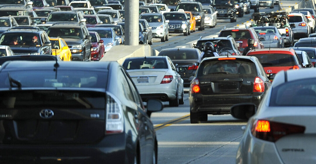 two way traffic of assorted vehicles on congested road