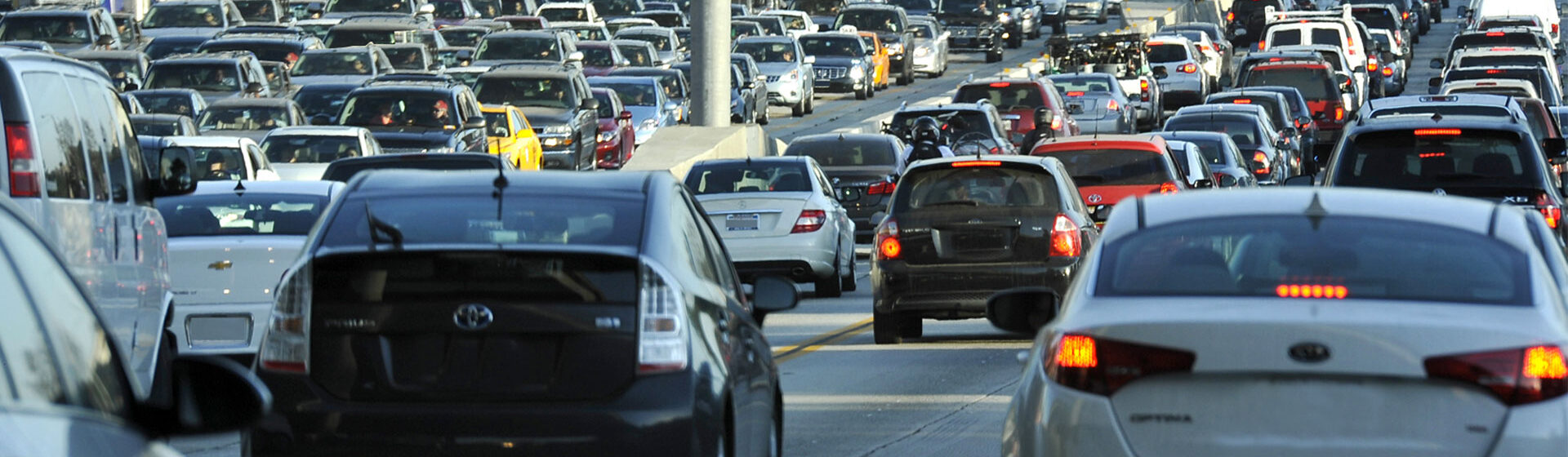two way traffic of assorted vehicles on congested road
