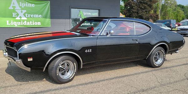 black Oldsmobile 442 outside Butch's
